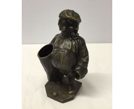 A bronze figure of golfer, possibly a pipe holder.