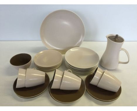 A Poole Pottery tea set in brown & cream colourway comprising 6 cups & saucers, 6 plates, sandwich plate, sugar bowl and jug.