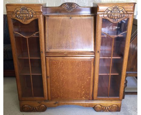 A light oak bureau bookcase with glazed doors (with keys).