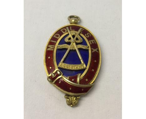 Large silver gilt & enamel masonic medal. Hallmarked Birmingham 1910. Front detail states Middlesex, Assistant. Size approx 8