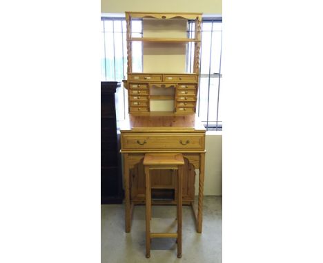 Stuart Stenning White, pine artists desk, with over 20 drawers and a cupboard 82cm wide and 206cm tall. Matching tall stool