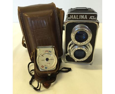 A Halina AI camera, in case with light meter.