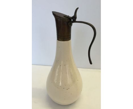 Ceramic claret jug with bronze handle & spout.