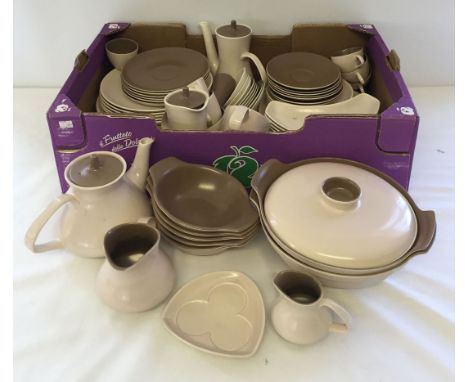 A quantity of two tone Poole dinner and tea ware to include: tureens, plates, tea pot, coffee pot.