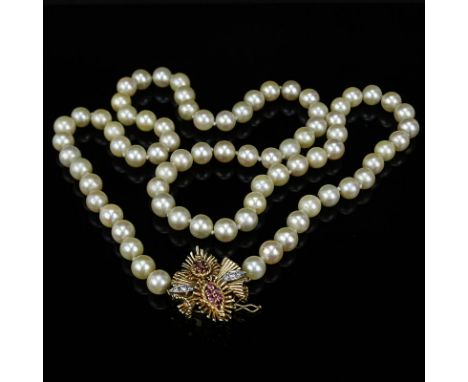 Vintage Single Strand White Pearl Necklace with 14 Karat Yellow Gold Clasp accented with Diamonds and Rubies. Pearls measure 