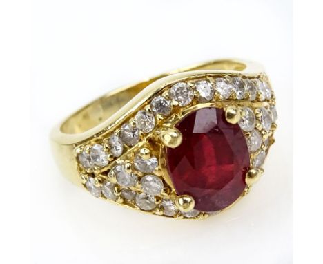 Vintage Oval Cut Ruby, Diamond and 14 Karat Yellow Gold Ring. Ruby measures 9mm x 7mm. Good condition. Ring size 7-3/4. Appro