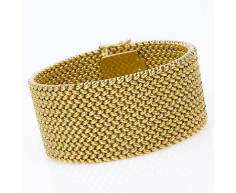 Vintage Heavy 18 Karat Yellow Gold Flexible Link Bracelet. Signed J.J. 18K. Good vintage condition. Measures 6-3/4" L, 1" W. 