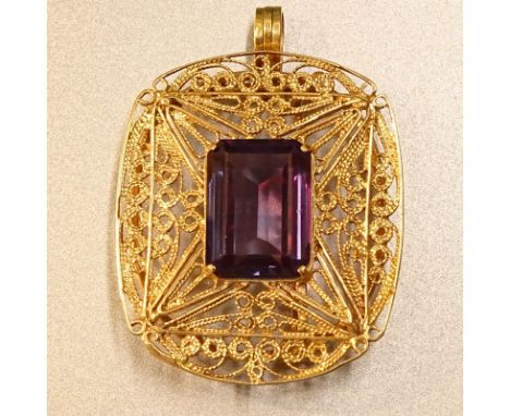 Vintage Emerald Cut Amethyst and 14 Karat Yellow Gold Filigree Pendant Brooch. Amethyst measures 18mm x 13mm. Hallmarked (? I