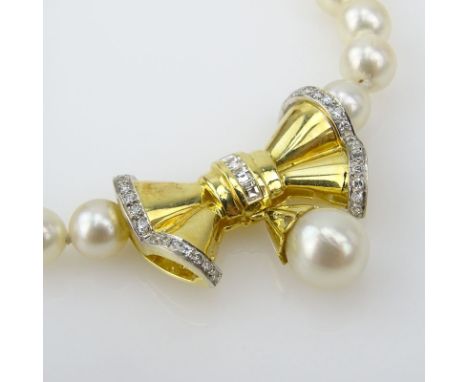 Vintage 6-8mm Pearl, Diamond and 18 Karat Yellow Gold Pendant  Necklace. Stamped 18K. Pearls with good luster and polish. Mea