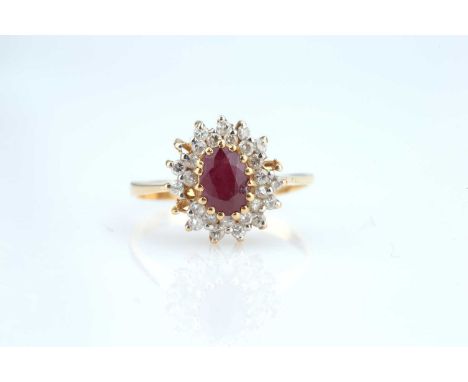 ruby with a cluster of 27 small diamonds (two missing from mount), Indian, 20th century, shank stamped 22k, acid tests as 22c