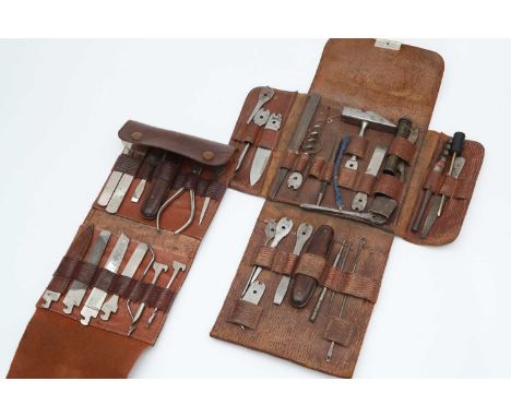 the first in a fold-out leather case and marked D.R.G.M. with many tools engraved with the Masons mark, the second larger set
