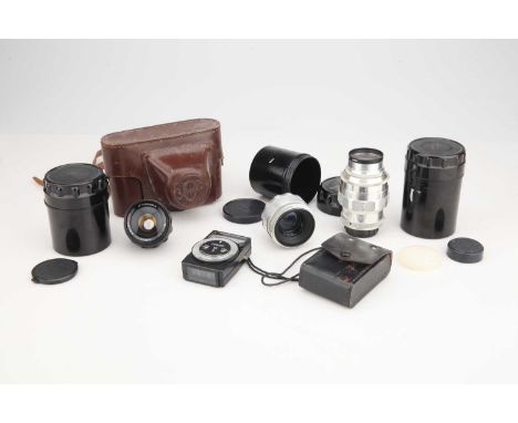 including a Jupiter-11 135mm f/4, a MIR-1 37mm f/2.8, a Helios-44 58mm f/2, also with a Zorki 3C camera case, and a Leningrad