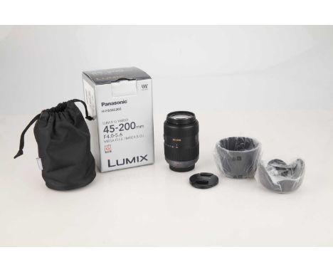 black, body VG-E, optics VG-E, untested on camera, comes with hood, front and rear caps, makers pouch, and makers box,