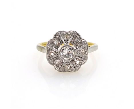 Art Deco platinum set diamond flower cluster ring on 18ct gold shank stamped 18ct.pt   Condition Report  3.1gmsize K Click he