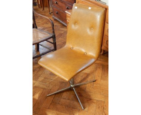 A pair of 20th century button leather swivel chairs, on chromed steel pedestal splayed legs, circa 1960