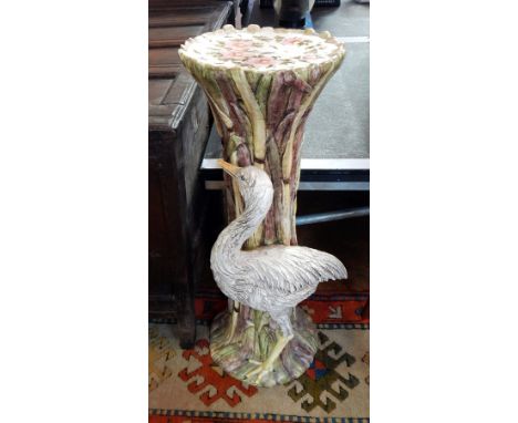 A decorative ceramic jardiniere stand with floral and bird decoration, height 78cm