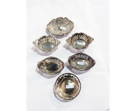 Silver pin tray with pierced stylised floral everted rim, Sheffield 1927, two pairs of sterling silver trinket dishes and ano