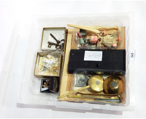 Various items to include golly enamel badges, painted lead model of a Noddy character pushing a wheelbarrow, small quantity j