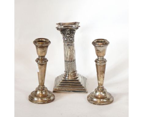 A pair of modern silver candlesticks, of cylindrical tapering form raised on a circular foot, Birmingham 1954, height 14cm, a