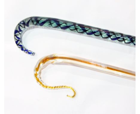 Aqua glass walking stick with blue and black spirally twisted interior and an ochre and clear glass walking stick (2) 