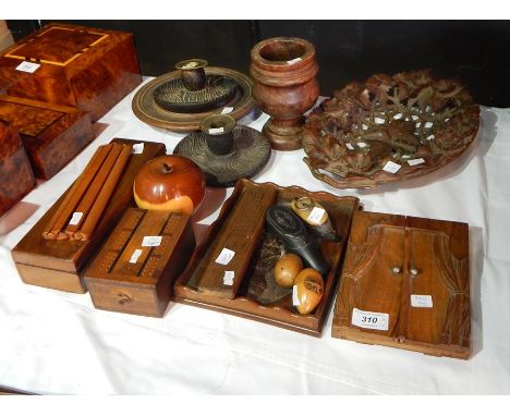 A quantity of treen to include a carved lime wood oval bowl, a turned wood mortar, a pair of turned wood candlesticks, cribba