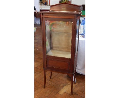 An Edwardian mahogany display cabinet, the glazed panel door with glazed sides to enclose shelves, on square tapering splayed