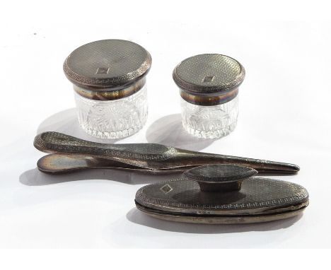 Four piece Mappin and Webb silver-mounted dressing table set viz:- two silver-topped cut glass jars, pair glove stretchers an