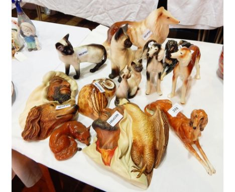 A quantity of china ceramic models of animals to include Beswick Siamese cat, fox together with two Bossons plaques of Arab m