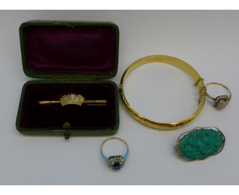 A 9ct gold brooch, a 9ct white gold and carved blue stone brooch, a 9ct rolled gold bangle and two 9ct gold and silver stone 