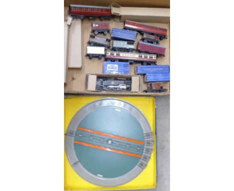 A Hornby Dublo 2-6-4 tank engine with coaches, wagons and turntable