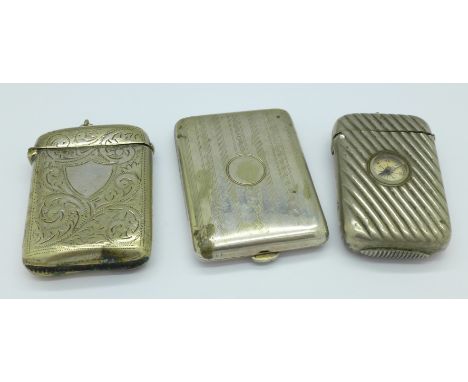 Two plated vesta cases, one with compass, and a matchbook holder