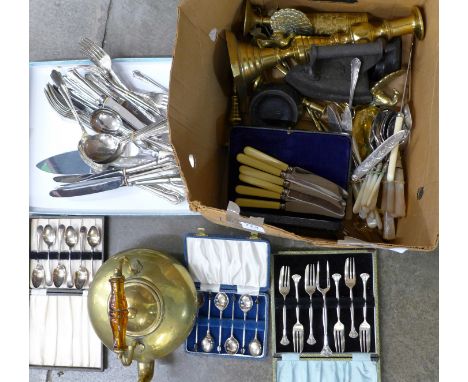 A brass kettle, brass candlesticks, kitchen scales, weights and a collection of plated flatware, including cased sets