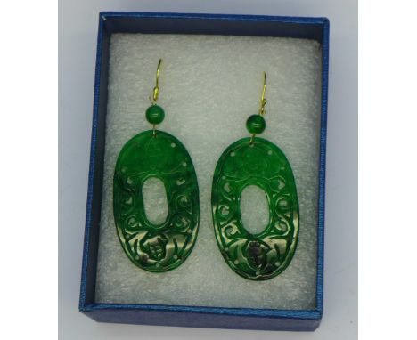A pair of silver gilt and hand carved jade earrings