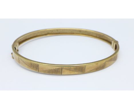A 9ct gold bangle, 8.3g