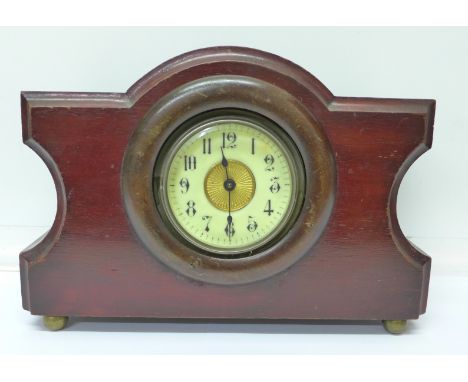 A wooden mantel clock