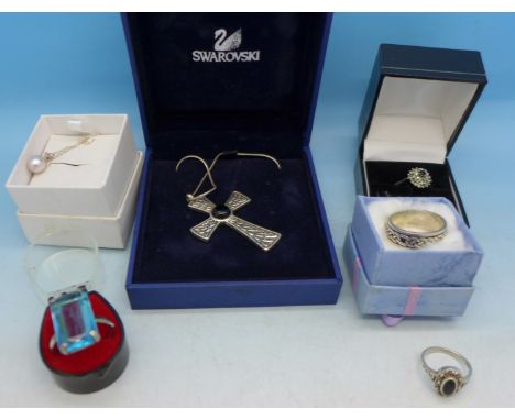 A Celtic style cross pendant, four silver rings and a pearl pendant with chain