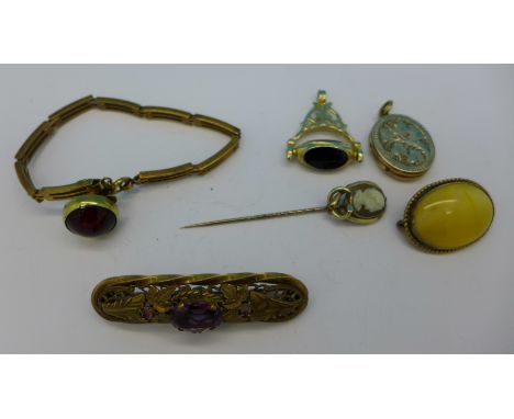 A locket, bracelet, cameo stick pin, two brooches, fob and a stud