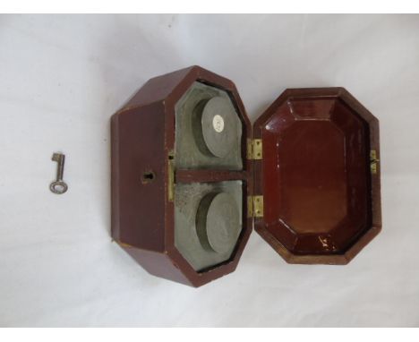 Oriental laquered sarcophagus form tea caddy with 2 pewter liners and key