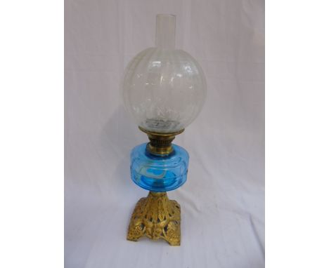 Blue glass oil lamp on guilded case metal base with etched shade and funnel