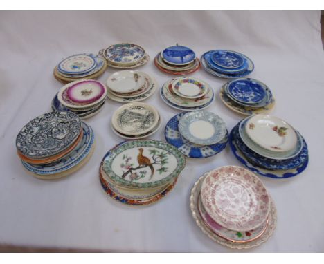 Collection of small cabinet plates and saucers including various blue and white examples