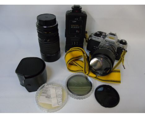 Collection of camera items and lenses by Canon Nikon and others to include a Nikon FG20
