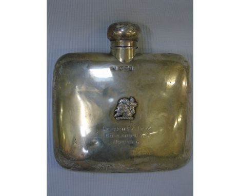 Hallmarked silver hip flask with a greek headed motif and chester hallmark inscribed Cpt F A Irby