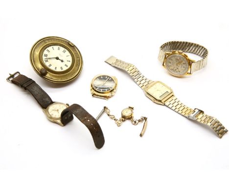 A ladies 9ct gold wristwatch, together with four gents wristwatches, and an alarm clock