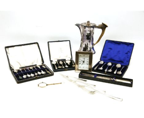 A collection of silver and silver plated items, to include a Harrods desk clock, a caddy spoon, lornettes and various flatwar