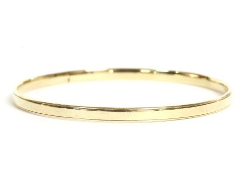 A 9ct gold solid flat section slave bangle, by Payton &amp; Pepper Ltd, 1923, 4.79mm wide, 20.31g
