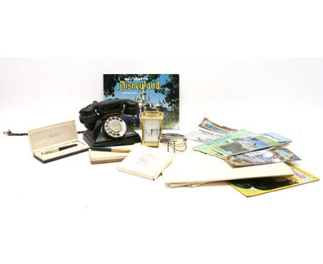 A vintage black bakelite telephone, together with a Barclays money box, two Parker pens, a carriage clock and a collection of