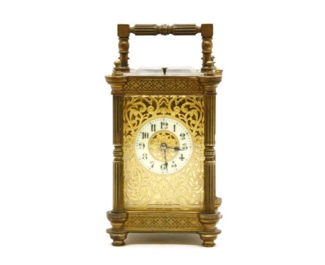 A late 19th to early 20th century brass carriage clock, two train eight day movement, striking on a gong with repeater, 19.5c