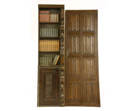 A faux oak bookcase section and books, with similar linen fold panel, 220cm high