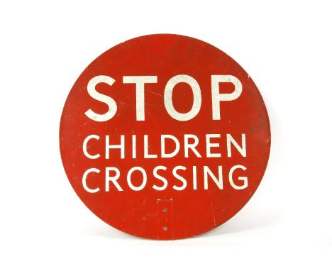 A vintage enamel lollipop persons sign, in red and white enamel, reading 'STOP, CHILDREN CROSSING'