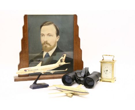 A brass carriage clock together with two pairs of binoculars, two model aeroplanes and two photograph frames